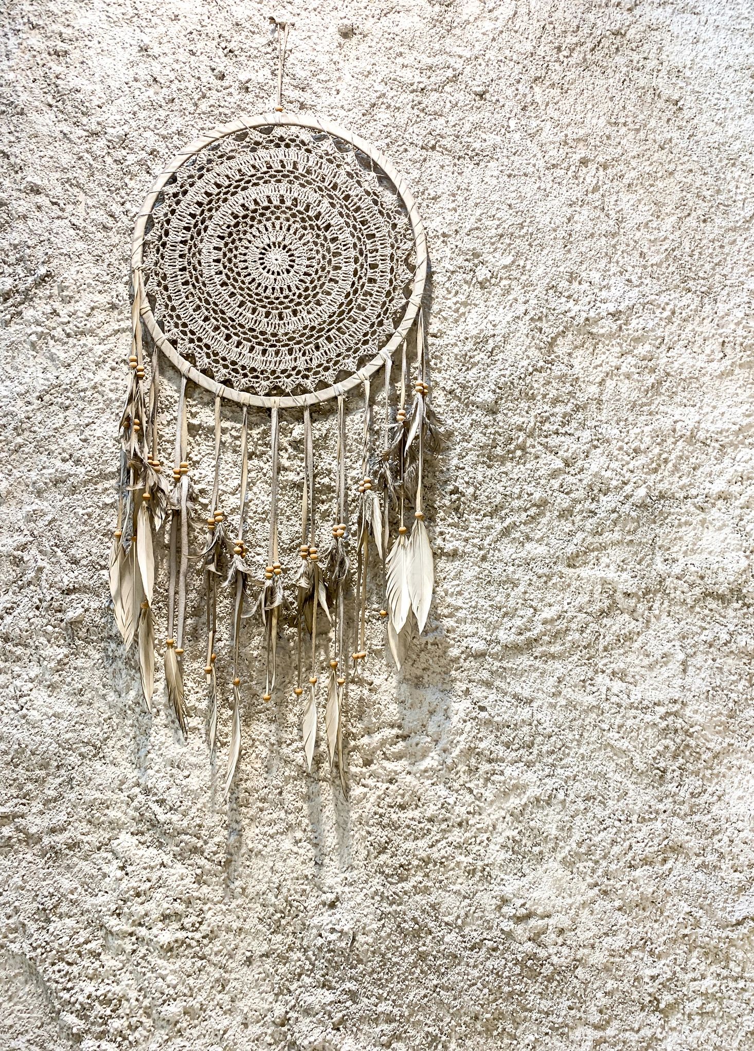 Handmade Aesthetic Dream catcher on white wall background